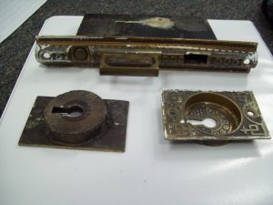 Mortise lock set and pulls from the sliding doors in main parlor in 813 S Cathedral Pl.